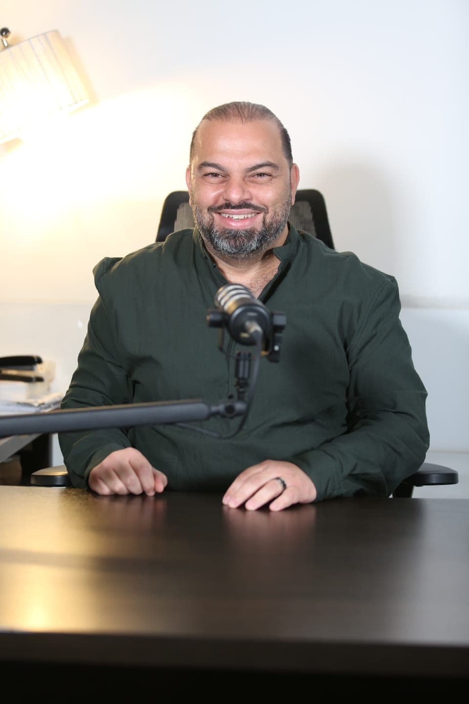 Dr. Mazen Alwani at the clinic desk